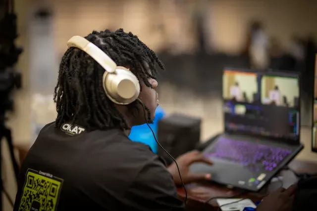 OKAT crew member live switching at the desk during an event